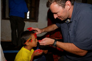 Giving Pujan a Tika