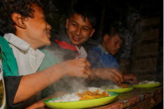 Kids Enjoying their Dal Bhat