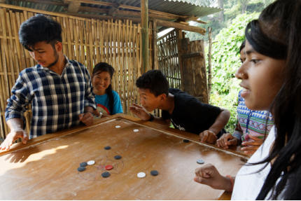 Kids playing caroom