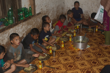Last night party - Kids eating goat and beaten rice